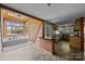 Spacious living room with a hot tub area, brick bar, and an open view at 126 Balmoral Dr, Mooresville, NC 28117