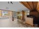 Open living space with a hot tub area and view into the kitchen at 126 Balmoral Dr, Mooresville, NC 28117