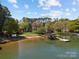 Picturesque lakefront homes with private beach access, docks and lush greenery offering a serene retreat at 126 Balmoral Dr, Mooresville, NC 28117