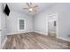 Bright bedroom with hardwood floors, one window, ceiling fan, and ensuite access at 128 Allenton St, Norwood, NC 28128