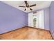 Empty bedroom features a ceiling fan and hardwood floors at 128 Allenton St, Norwood, NC 28128