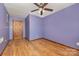 Empty bedroom features hardwood floors and a wood door at 128 Allenton St, Norwood, NC 28128