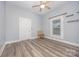 Bedroom with wood-look flooring, neutral walls, one window, and a ceiling fan at 128 Allenton St, Norwood, NC 28128