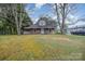 Charming home featuring a covered front porch with detailed supports, offering a cozy and inviting curb appeal at 128 Allenton St, Norwood, NC 28128