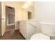 Well-maintained bathroom with vinyl floors, vanity, toilet, and grab bars for added accessibility at 1415 Troon Dr, Salisbury, NC 28144