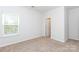 Well-lit bedroom with carpet flooring and a window, offering a bright and airy atmosphere at 1415 Troon Dr, Salisbury, NC 28144