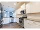 A bright kitchen featuring stainless steel appliances, granite countertops, and white cabinets at 1415 Troon Dr, Salisbury, NC 28144