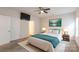 Relaxing main bedroom featuring a plush bed, TV, and ample natural light, providing a luxurious retreat at 1415 Troon Dr, Salisbury, NC 28144