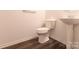 Cozy powder room with pedestal sink and modern fixtures, perfect for guests at 1415 Troon Dr, Salisbury, NC 28144