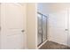 Accessible walk-in shower with clear glass door and modern fixtures near closet at 1415 Troon Dr, Salisbury, NC 28144