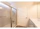 Accessible walk-in shower with safety bar and clear glass door for easy access at 1415 Troon Dr, Salisbury, NC 28144