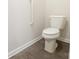 Standard toilet featuring easy access and safety bar for easy accessibility at 1415 Troon Dr, Salisbury, NC 28144
