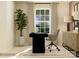 Bright home office with a modern black desk, comfortable chair, and ample natural light at 1416 Pine Heart Dr, Edgemoor, SC 29712