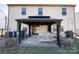 Charming covered patio with seating, offering a relaxing outdoor space with views of the backyard at 154 Rooster Tail Ln, Troutman, NC 28166
