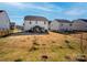 Spacious backyard, perfect for outdoor activities and entertaining, featuring a patio with a pergola at 154 Rooster Tail Ln, Troutman, NC 28166