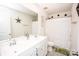 Clean bathroom with dual vanity sinks, and bathtub with shower at 154 Rooster Tail Ln, Troutman, NC 28166