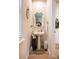 This powder room includes a pedestal sink, decorative mirror and fixtures at 154 Rooster Tail Ln, Troutman, NC 28166