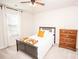 Inviting bedroom with a ceiling fan, warm lighting, and dresser at 154 Rooster Tail Ln, Troutman, NC 28166