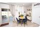 A dining area with seating for four features sliding glass doors and views of the backyard at 154 Rooster Tail Ln, Troutman, NC 28166