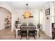 Bright dining room with a decorative light fixture, stylish table, and wainscoting, creating a cozy ambiance at 154 Rooster Tail Ln, Troutman, NC 28166