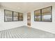 Covered back porch has two large windows and a sliding glass door into the home at 163 Windy Dell Dr, Tega Cay, SC 29708