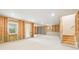 Unfinished basement with a door to outside, concrete floor, and framing for future rooms at 163 Windy Dell Dr, Tega Cay, SC 29708