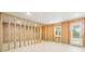 Unfinished basement with a door to outside, concrete floor, and framing for future rooms at 163 Windy Dell Dr, Tega Cay, SC 29708
