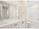 Bathroom featuring double sinks, quartz countertop, and a combined shower and bathtub at 163 Windy Dell Dr, Tega Cay, SC 29708