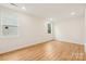 Bright bedroom with new carpet, two windows, and neutral paint color at 163 Windy Dell Dr, Tega Cay, SC 29708