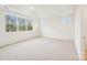 Large bedroom with three windows, recessed lighting, and tray ceiling at 163 Windy Dell Dr, Tega Cay, SC 29708