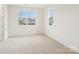 Bright bedroom with large windows offering natural light and neighborhood views at 163 Windy Dell Dr, Tega Cay, SC 29708