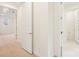 Bright hallway with neutral carpet leads to additional rooms and bathroom at 163 Windy Dell Dr, Tega Cay, SC 29708