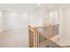 Second floor loft area with new carpet, neutral paint, and natural light at 163 Windy Dell Dr, Tega Cay, SC 29708