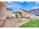 A home's backyard features a patio and an outdoor bar area with seating and a tv at 16606 Spruell St, Huntersville, NC 28078