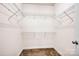 Empty walk-in closet with wire shelving and neutral carpeting at 16606 Spruell St, Huntersville, NC 28078