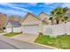 A detached two car garage sits behind a white privacy fence at 16606 Spruell St, Huntersville, NC 28078