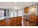 Spacious kitchen with granite countertops, stainless steel appliances, and hardwood floors at 16606 Spruell St, Huntersville, NC 28078