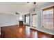 Living room with fireplace, ceiling fan, and door to the outside at 16606 Spruell St, Huntersville, NC 28078