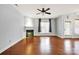 Open living area features hardwood floors, fresh paint, and a modern fireplace at 16606 Spruell St, Huntersville, NC 28078