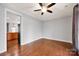 Spacious living room features hardwood floors and access to the dining room at 16606 Spruell St, Huntersville, NC 28078