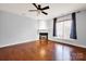 Cozy living room showcases hardwood floors, fireplace, and fresh paint at 16606 Spruell St, Huntersville, NC 28078