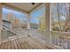 Covered front porch with white railing offers a charming outdoor space at 16606 Spruell St, Huntersville, NC 28078