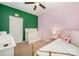 This charming bedroom boasts a crib and changing table, ideal for a cozy Bedroom setup at 253 W G St, Kannapolis, NC 28081