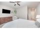 This bedroom features a television and a potted plant, adding a touch of nature to the space at 253 W G St, Kannapolis, NC 28081