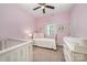Pink bedroom with a brass bed frame, and decor at 253 W G St, Kannapolis, NC 28081