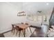 Inviting dining room with hardwood floors, a stylish chandelier, and open to the living area at 253 W G St, Kannapolis, NC 28081