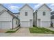 Townhome exterior featuring a driveway to a private garage and individual entrance at 253 W G St, Kannapolis, NC 28081