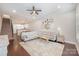 Open-concept living room featuring hardwood floors, neutral colors, and access to the kitchen at 253 W G St, Kannapolis, NC 28081