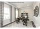 Well-lit home office with dual windows, hardwood floors, a large desk, and modern decor at 3010 Bramble Hedge Rd # 3271, Indian Trail, NC 28079