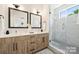 Modern bathroom features a double vanity, sleek mirrors, and a glass-enclosed shower at 3011 Yada Ln, Charlotte, NC 28208